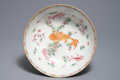 A large Chinese famille rose bowl with figures in a garden, Yongzheng