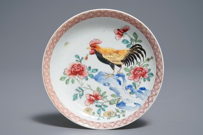A Chinese famille rose cup and saucer with roosters, Yongzheng
