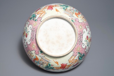 A large Chinese famille rose bowl with figures in a garden, Yongzheng