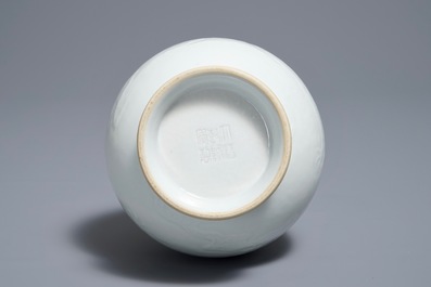 A Chinese blanc de Chine vase with underglaze dragon design, Qianlong mark, 19/20th C.