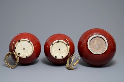 Three Chinese sang-de-boeuf-glazed bottle vases, 20th C.