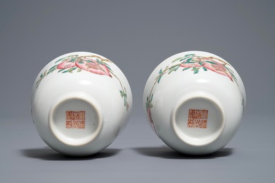 A pair of Chinese famille rose pomegranate cups, Daoguang mark, 19/20th C.