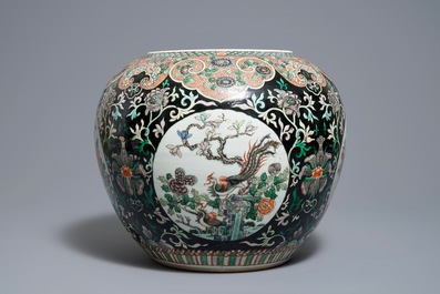 A Chinese famille noire jardini&egrave;re on stand, 19th C.