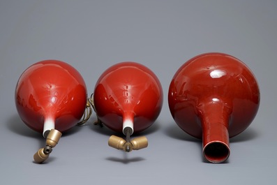 Three Chinese sang-de-boeuf-glazed bottle vases, 20th C.