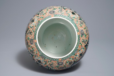 A Chinese famille noire jardini&egrave;re on stand, 19th C.
