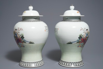 A pair of Chinese famille rose vases and covers, Qianlong mark, 20th C.