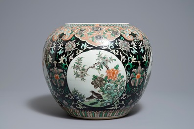A Chinese famille noire jardini&egrave;re on stand, 19th C.