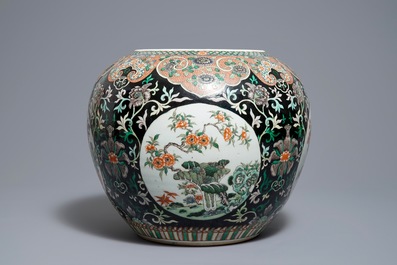 A Chinese famille noire jardini&egrave;re on stand, 19th C.