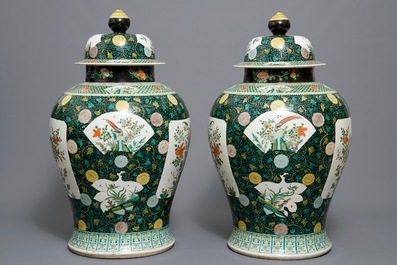 A pair of large Chinese famille noire vases and covers, 19/20th C.