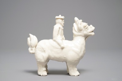 A Chinese Dehua blanc de Chine model of a man on a qilin, Kangxi
