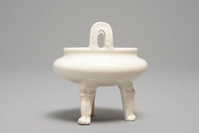 A Chinese Dehua blanc de Chine tripod censer, impressed seal mark, Kangxi