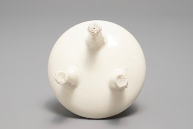 A Chinese Dehua blanc de Chine tripod censer, impressed seal mark, Kangxi