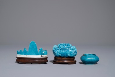 A Chinese turquoise-glazed brush rest and two small brushwashers, Kangxi