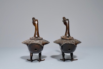 A pair of Chinese bronze duck-shaped incense burners and covers, 18/19th C.