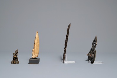 Two Tibetan votive plaques, a coral-inlaid silver amulet and a small bronze group, 18/19th C.