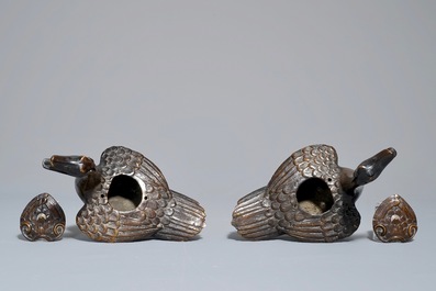 A pair of Chinese bronze duck-shaped incense burners and covers, 18/19th C.