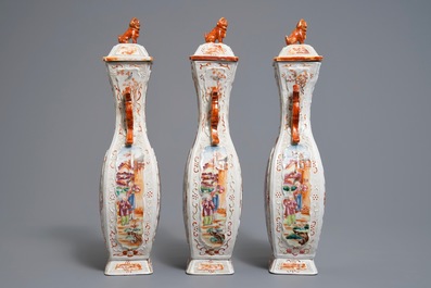 Three Chinese famille rose 'mandarin' vases and covers, Qianlong