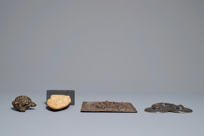 Two Tibetan votive plaques, a coral-inlaid silver amulet and a small bronze group, 18/19th C.