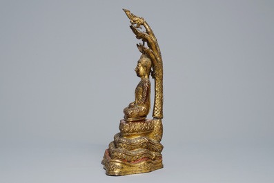 An inlaid gilt-lacquered bronze figure of Buddha, Burma, 19th C.