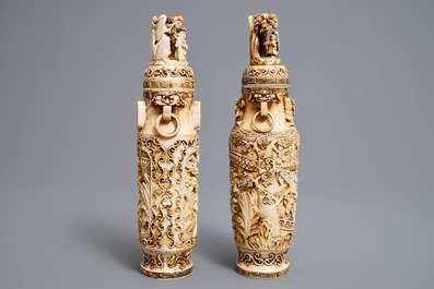 A pair of Chinese ivory vases and covers with figures in landscapes, 1st quarter 20th C.