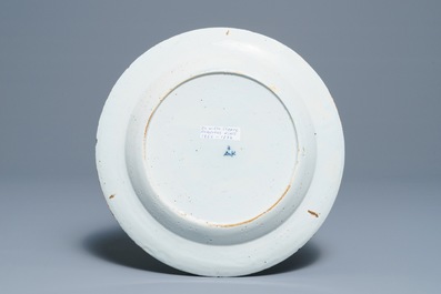A Dutch Delft blue and white dish with figures in a landscape, 18th C.