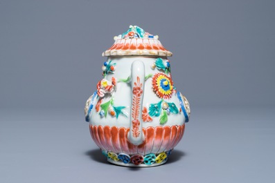 A Chinese famille rose teapot with applied floral design, Yongzheng