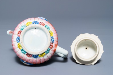 A Chinese famille rose teapot with applied floral design, Yongzheng