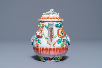 A Chinese famille rose teapot with applied floral design, Yongzheng