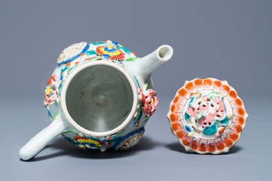 A Chinese famille rose teapot with applied floral design, Yongzheng