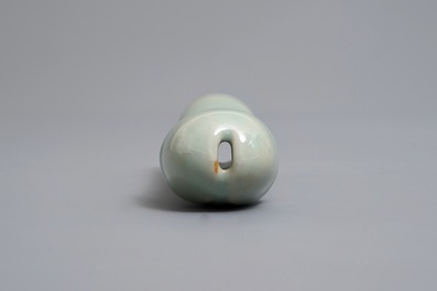 A Chinese longquan celadon model of a phallus, Ming or later