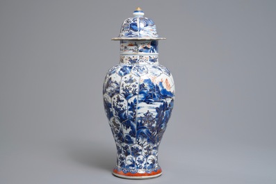 A Chinese clobbered blue and white vase and cover with landscape design, Kangxi