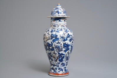 A Chinese clobbered blue and white vase and cover with landscape design, Kangxi