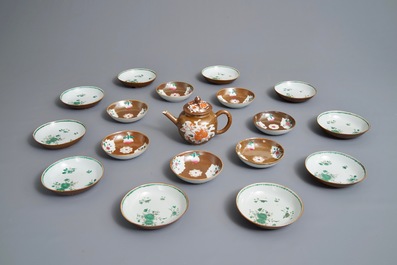 A Chinese Imari style capucin ground teapot and 17 cups and saucers, Qianlong