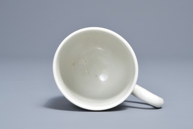 A Dutch-decorated Chinese cup with the royal Dutch arms of Oranje-Nassau, dated 1747, Qianlong