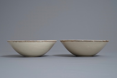 A pair of Chinese qingbai moulded 'phoenix' bowls, Song