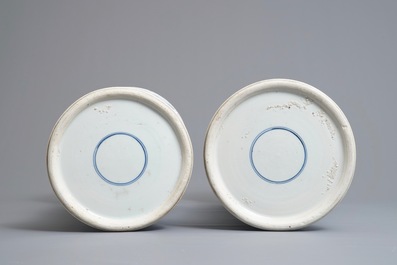 A large Chinese blue and white three-piece garniture with landscape and floral panels, Kangxi
