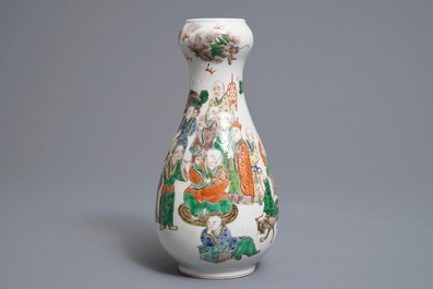 A Chinese famille verte pear-shaped bottle vase with Luohans, 19th C.