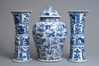 A large Chinese blue and white three-piece garniture with landscape and floral panels, Kangxi