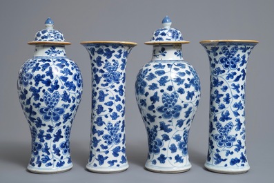 A Chinese blue and white four-piece garniture with floral design, Kangxi