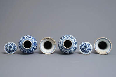 A Chinese blue and white four-piece garniture with floral design, Kangxi