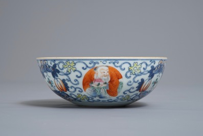 A Chinese famille verte vase and a famille rose bowl, 19th C.