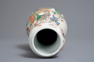A Chinese famille verte pear-shaped bottle vase with Luohans, 19th C.