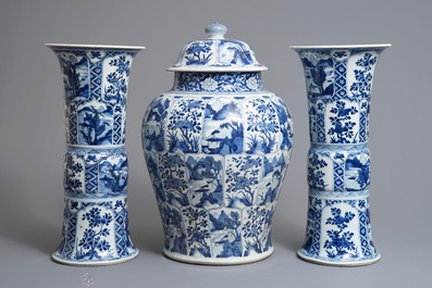 A large Chinese blue and white three-piece garniture with landscape and floral panels, Kangxi