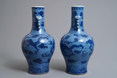A pair of Chinese lavender blue vases with underglaze dragons, 18/19th C.
