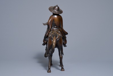 A large Japanese bronze group of a sage on horseback, Meiji, 19th C.
