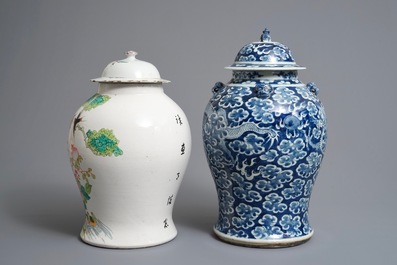 Two Chinese blue and white and famille rose vases and covers, 19/20th C.