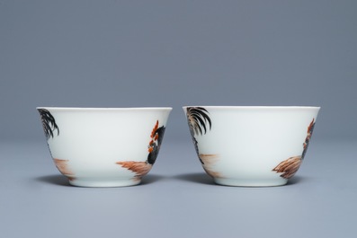 A pair of fine Chinese cups and saucers with roosters and chickens, Qianlong