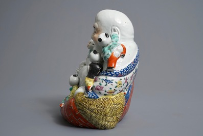 A Chinese famille rose figure of Buddha, 19/20th C.