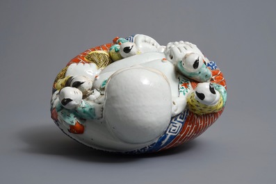 A Chinese famille rose figure of Buddha, 19/20th C.