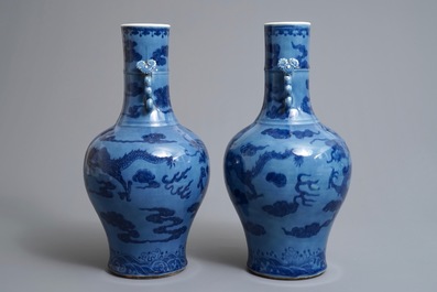 A pair of Chinese lavender blue vases with underglaze dragons, 18/19th C.